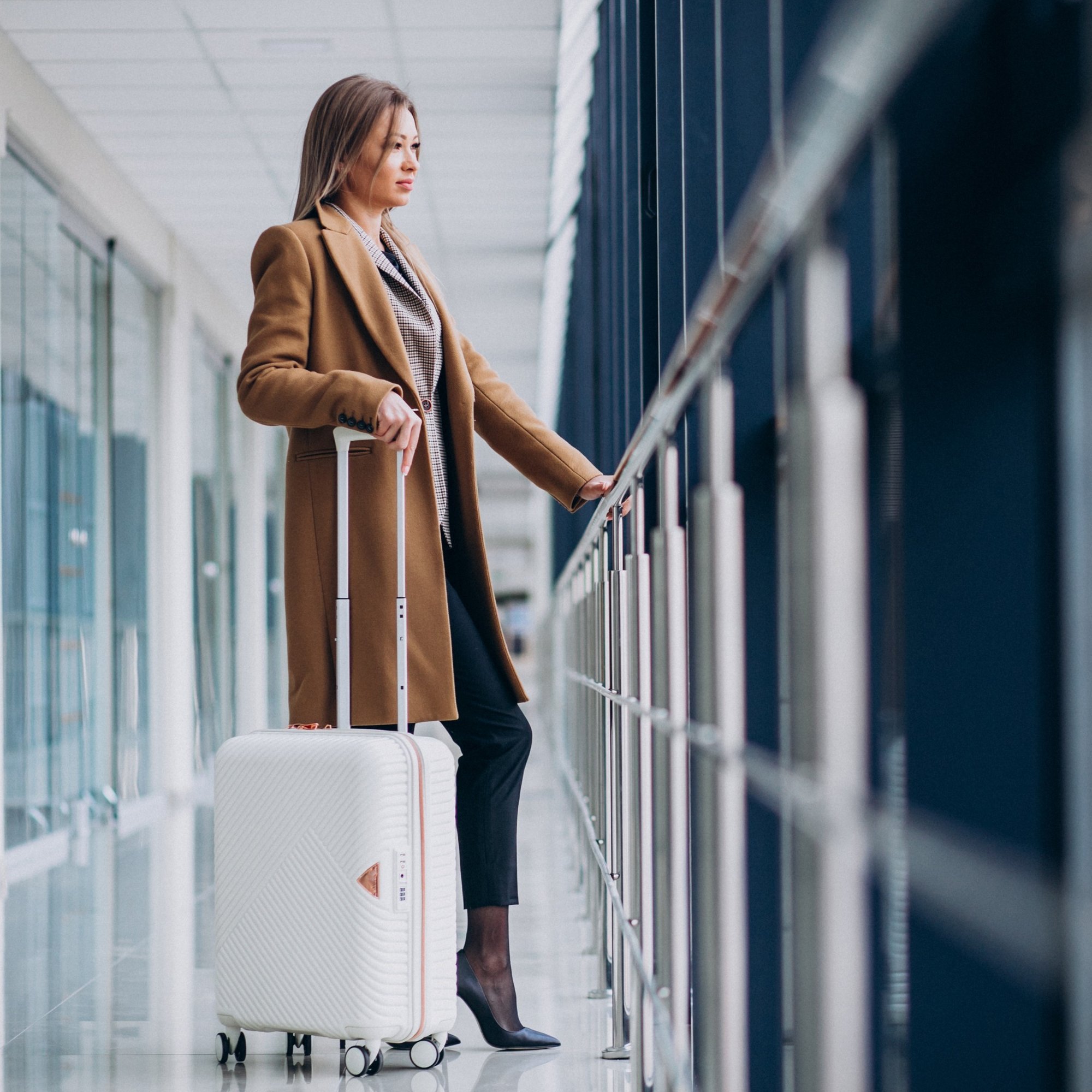 business-woman-with-travel-bag-airport