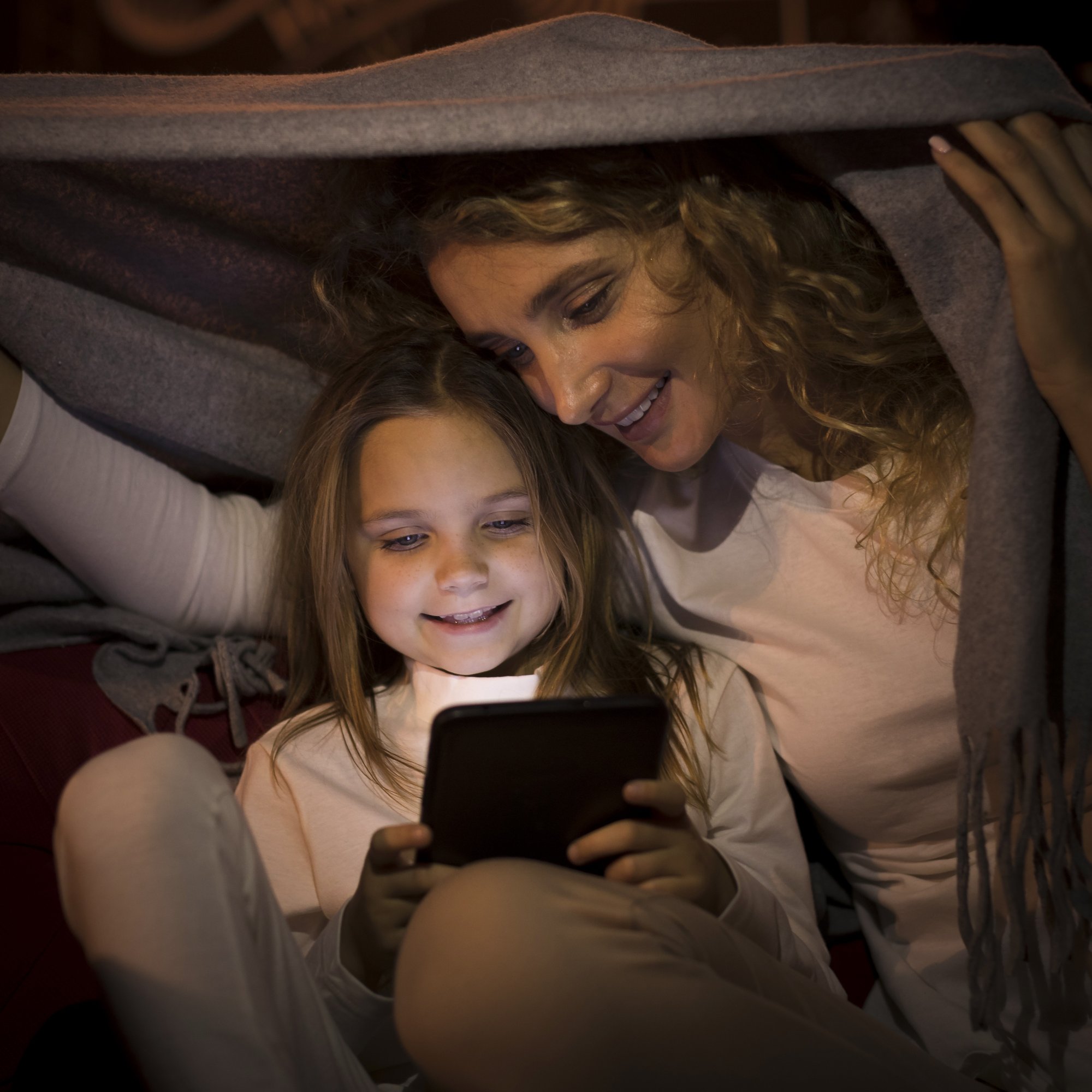 front-view-mother-daughter-spending-time-together-blanket front-view-mother-daughter-spending-time-together-blanket